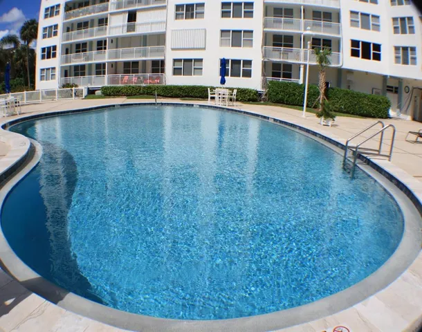 a view of building with swimming pool