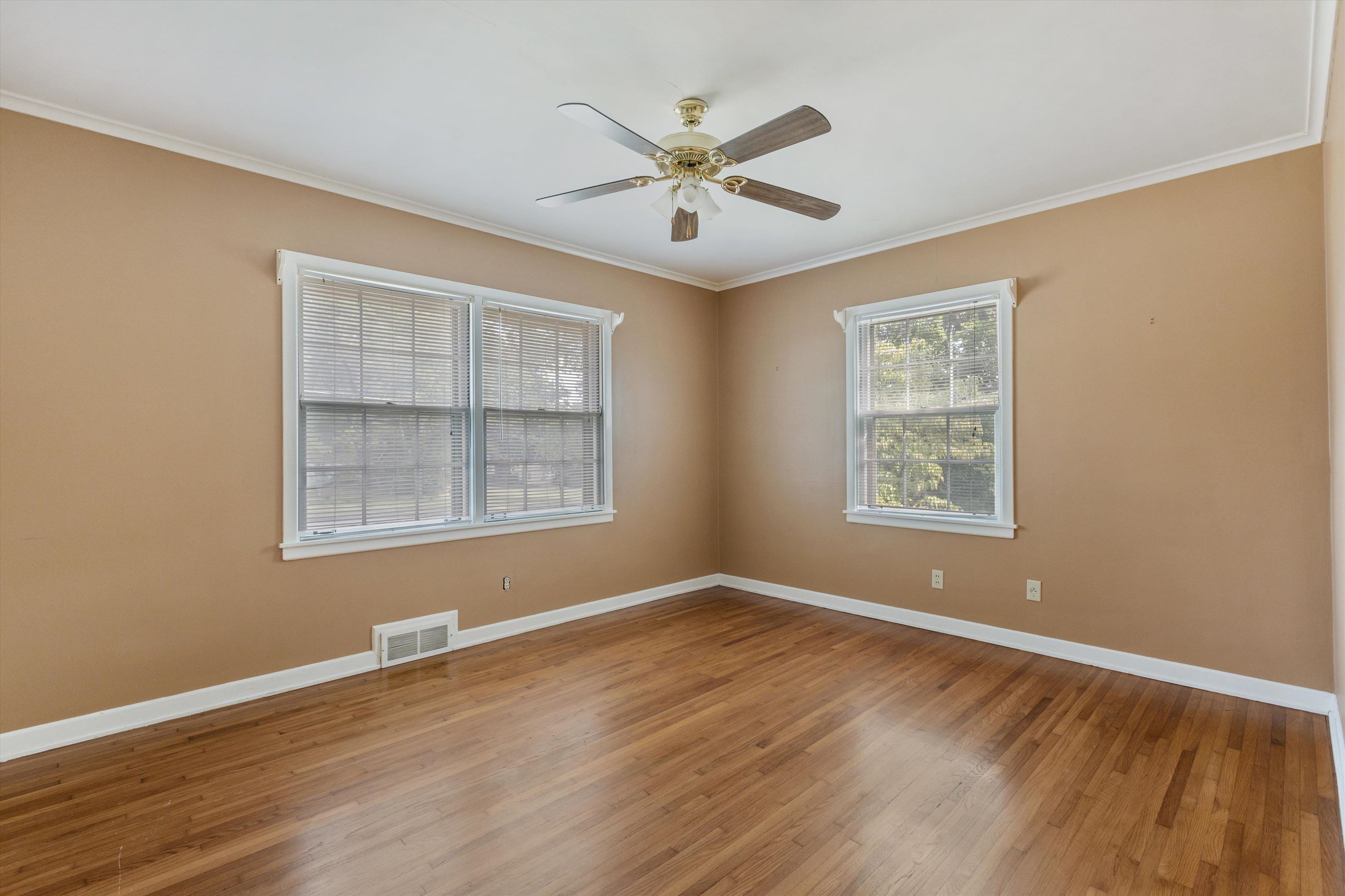 131 North Mendenhall Road Memphis, TN 38117 - Photo 20 of 26 a view of an empty room with wooden floor and a window