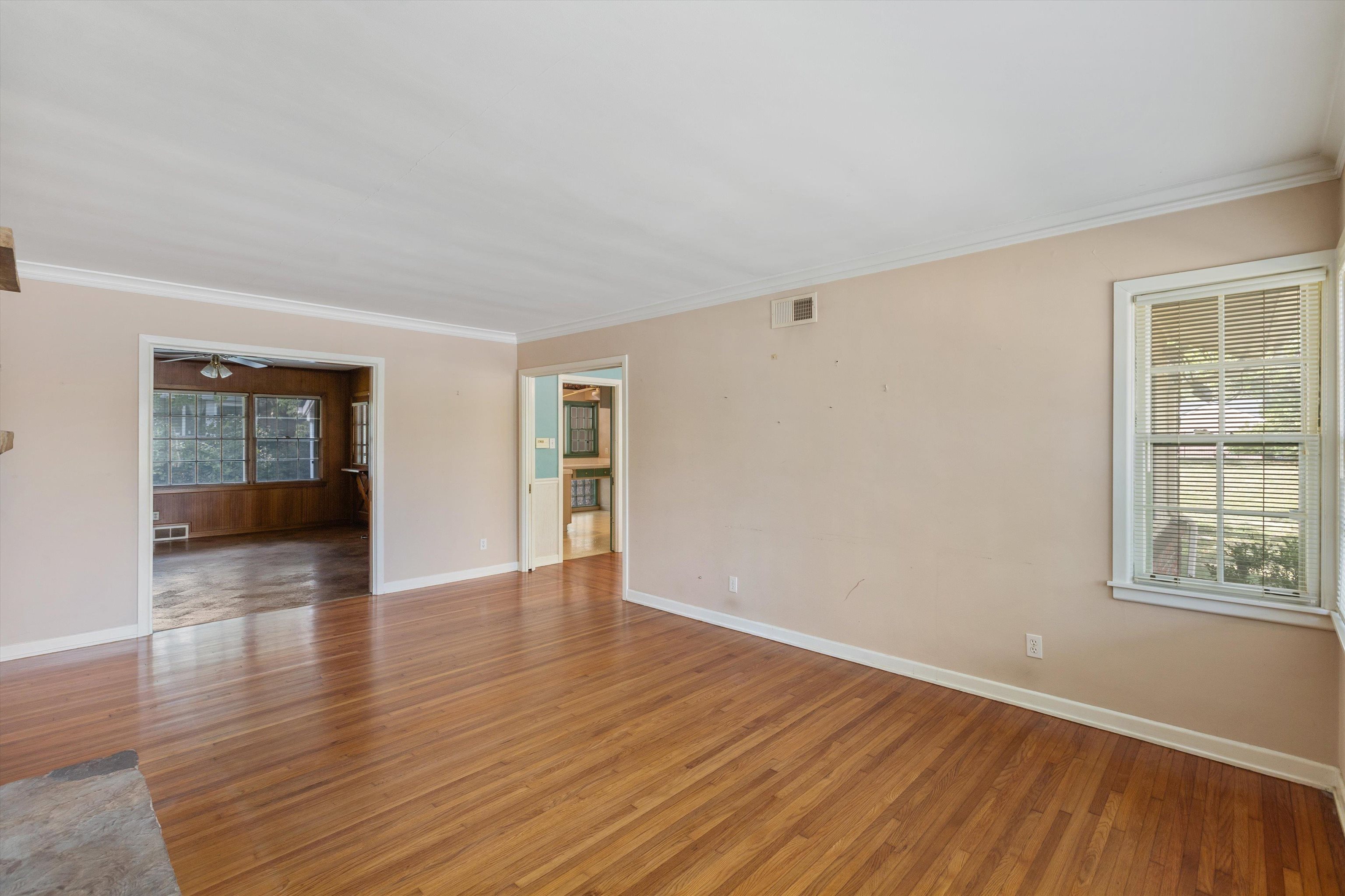 131 North Mendenhall Road Memphis, TN 38117 - Photo 8 of 26 a view of an empty room with wooden floor and a window