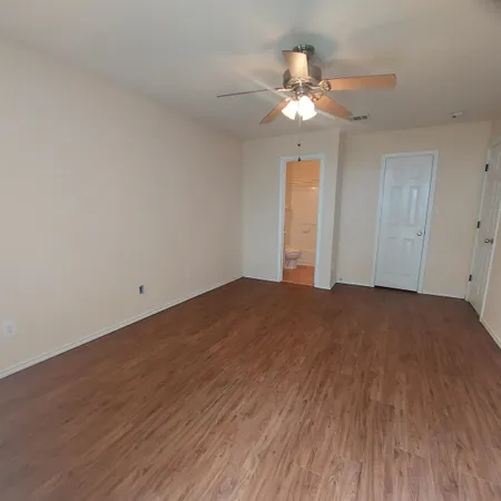a view of a livingroom with a chandelier fan