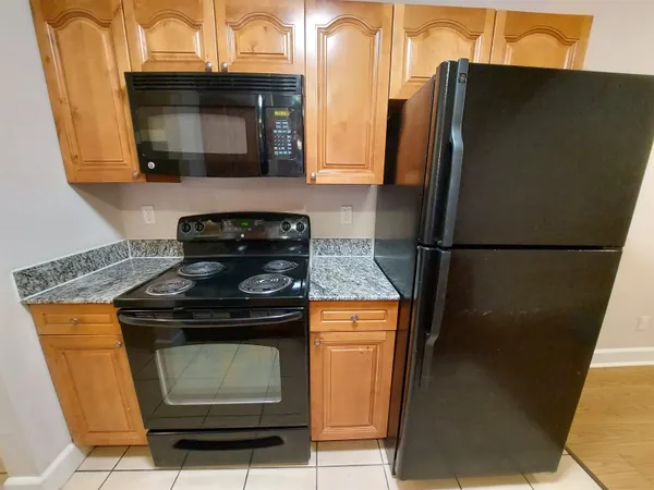 a kitchen with a stove and a microwave