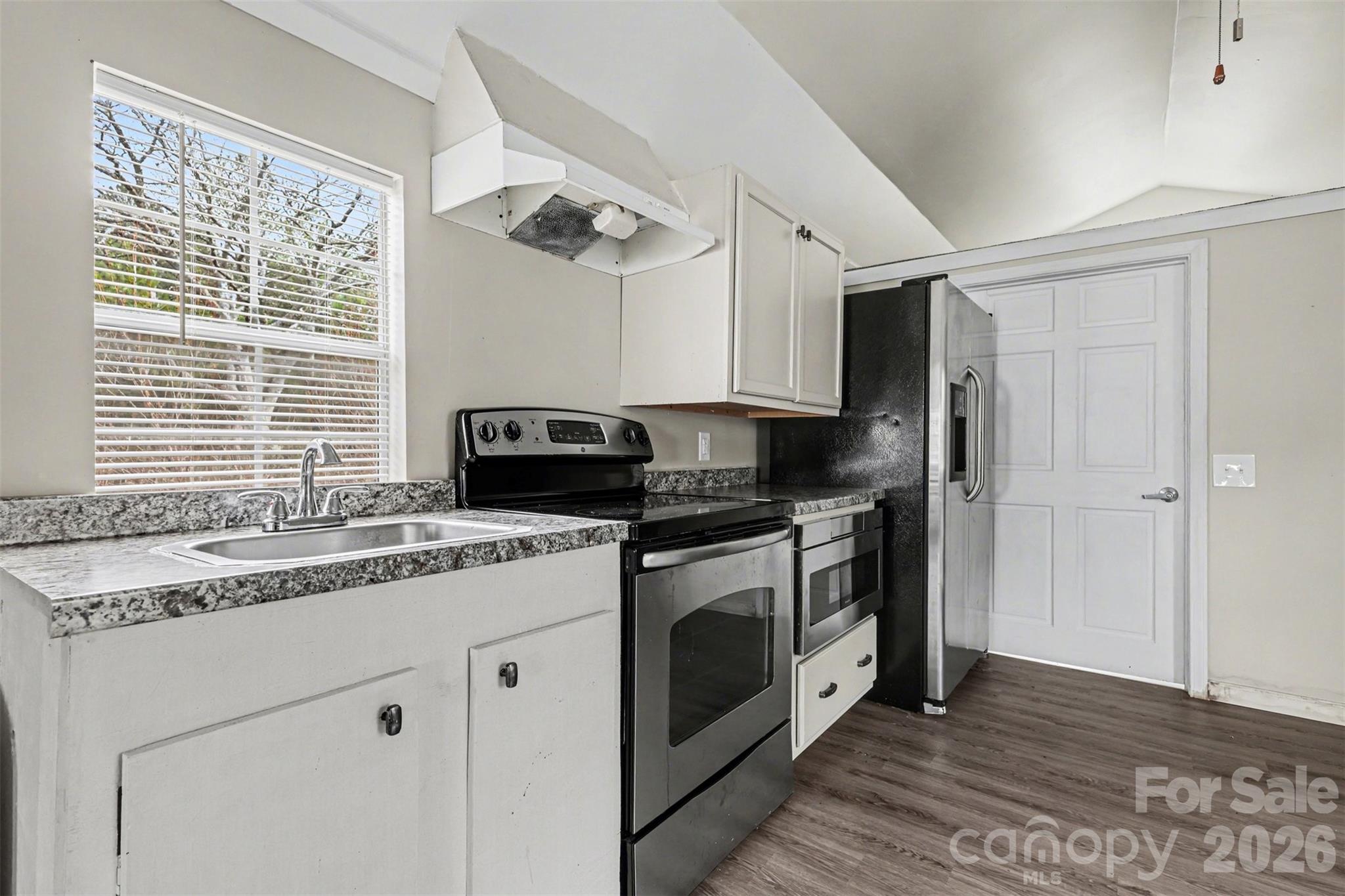 596 Armory Road Chester, SC 29706 - Photo 12 of 25 a kitchen with stainless steel appliances granite countertop a sink and a stove