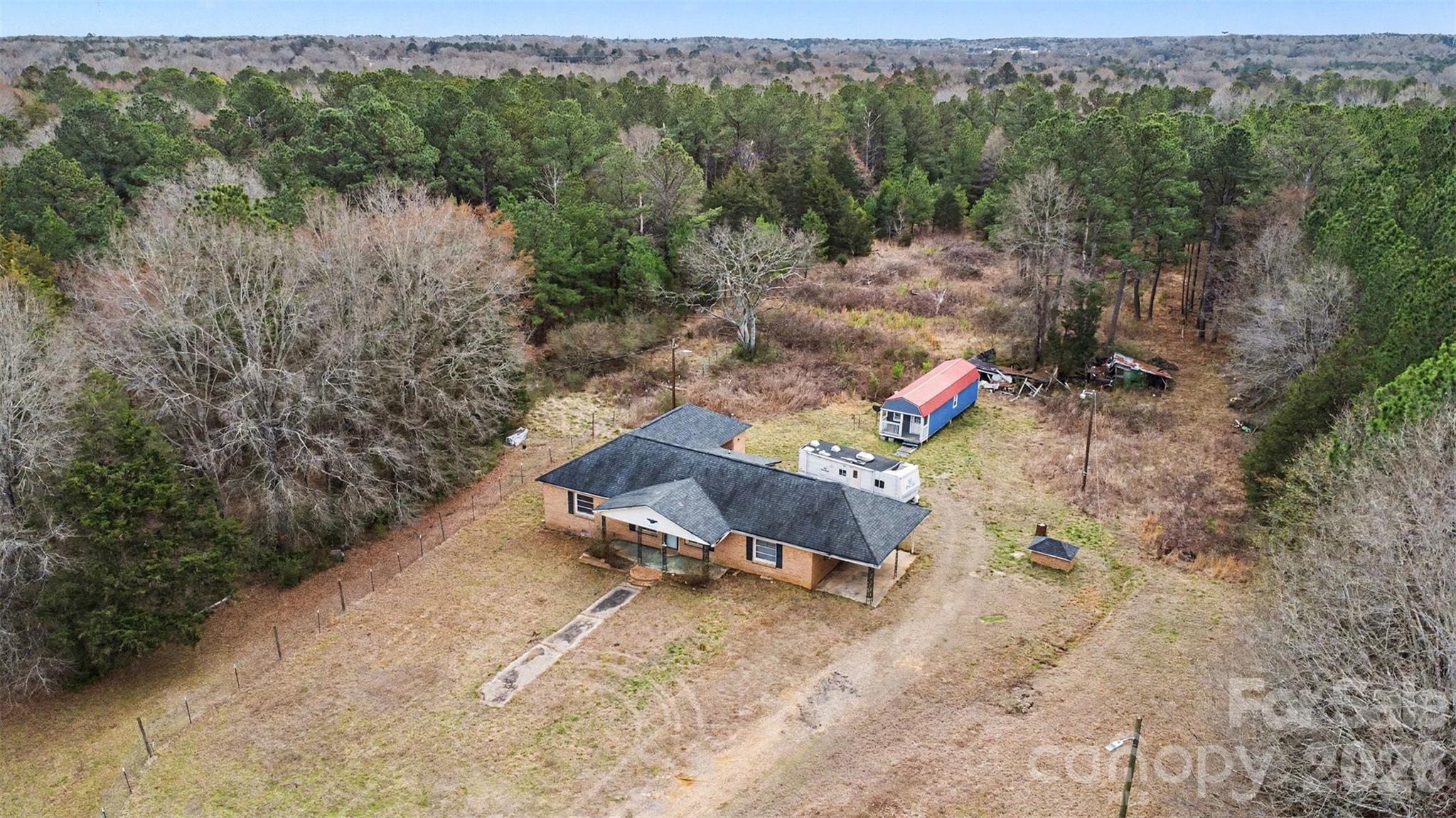 596 Armory Road Chester, SC 29706 - Photo 24 of 25 a backyard of a house with a yard and outdoor seating