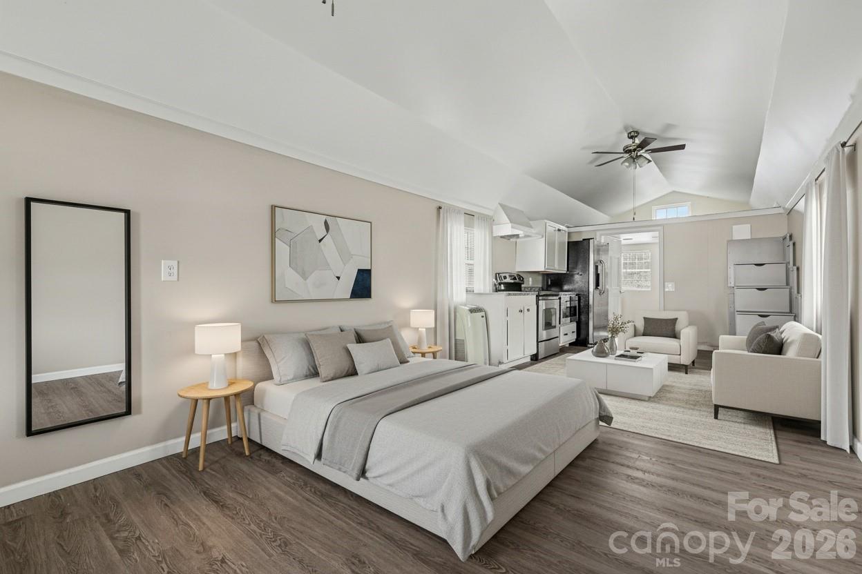 596 Armory Road Chester, SC 29706 - Photo 8 of 25 a spacious bedroom with a bed and ceiling fan