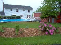 223 East Windsor Road Peru, MA 01235 - Photo 2 of 2 a view of house with garden and a yard