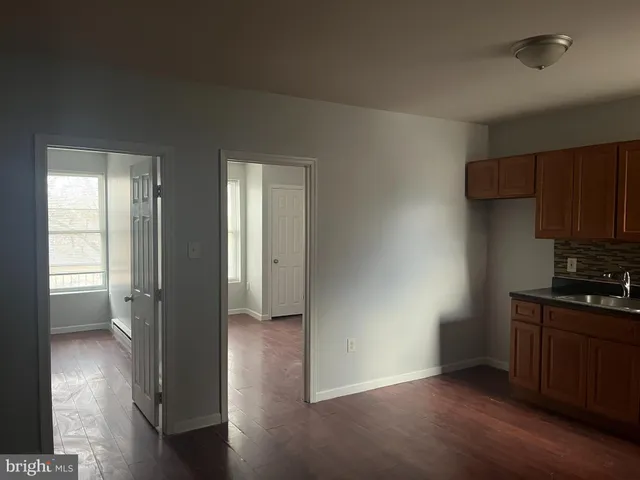 a view of a kitchen cabinets and wooden floor