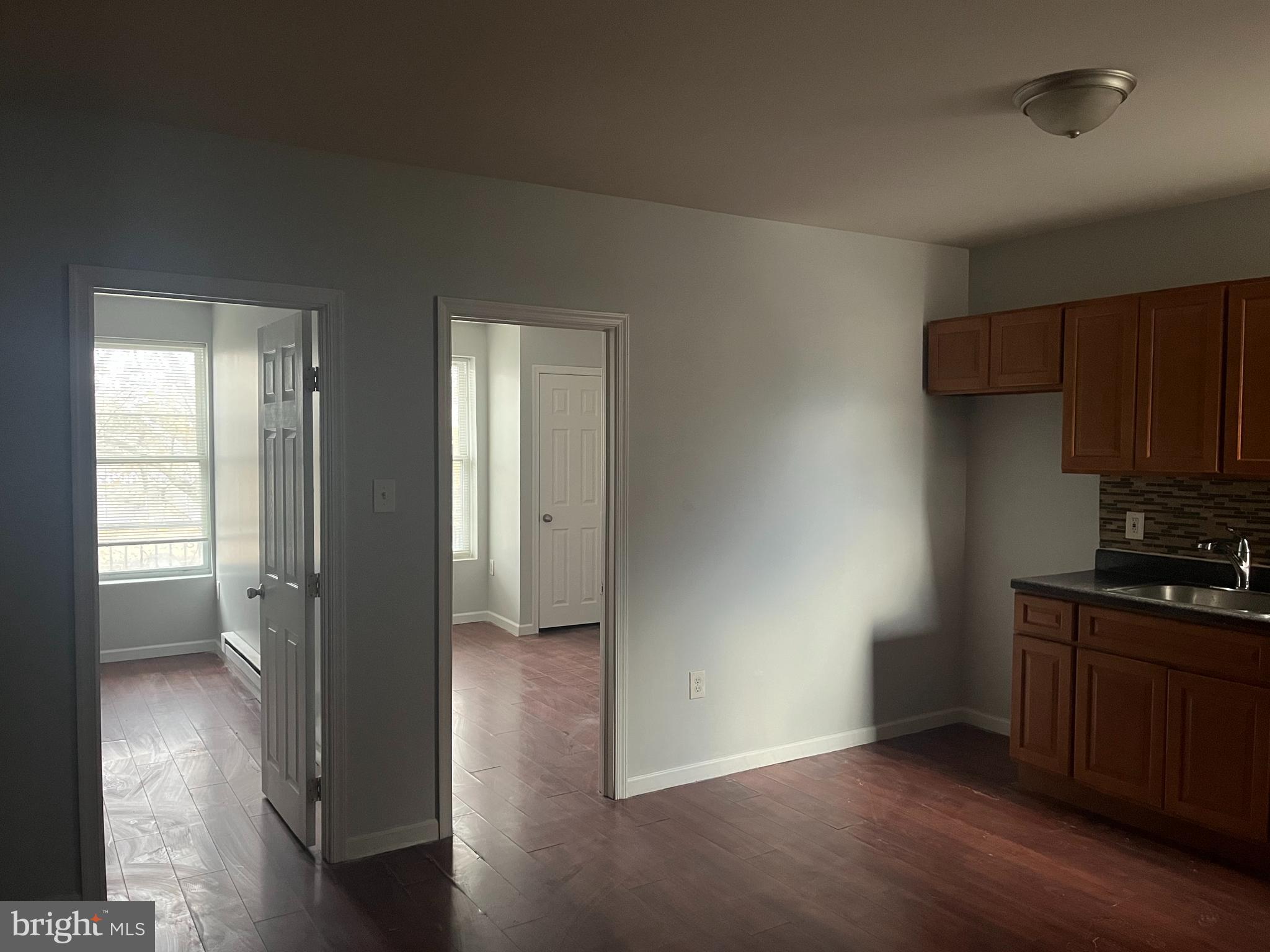6122 North Broad Street Philadelphia, PA 19141 - Photo 12 of 18 a view of a kitchen cabinets and wooden floor