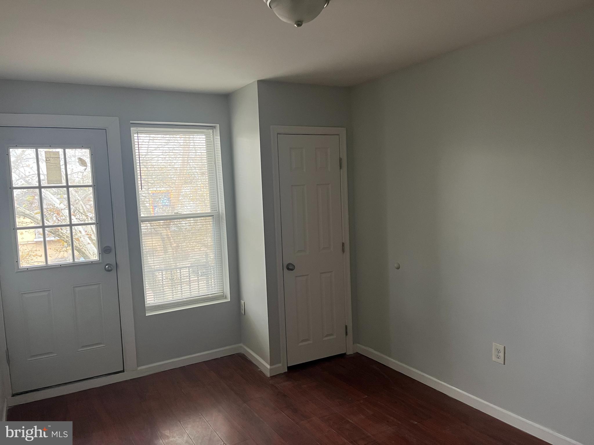 6122 North Broad Street Philadelphia, PA 19141 - Photo 14 of 18 an empty room with wooden floor and windows