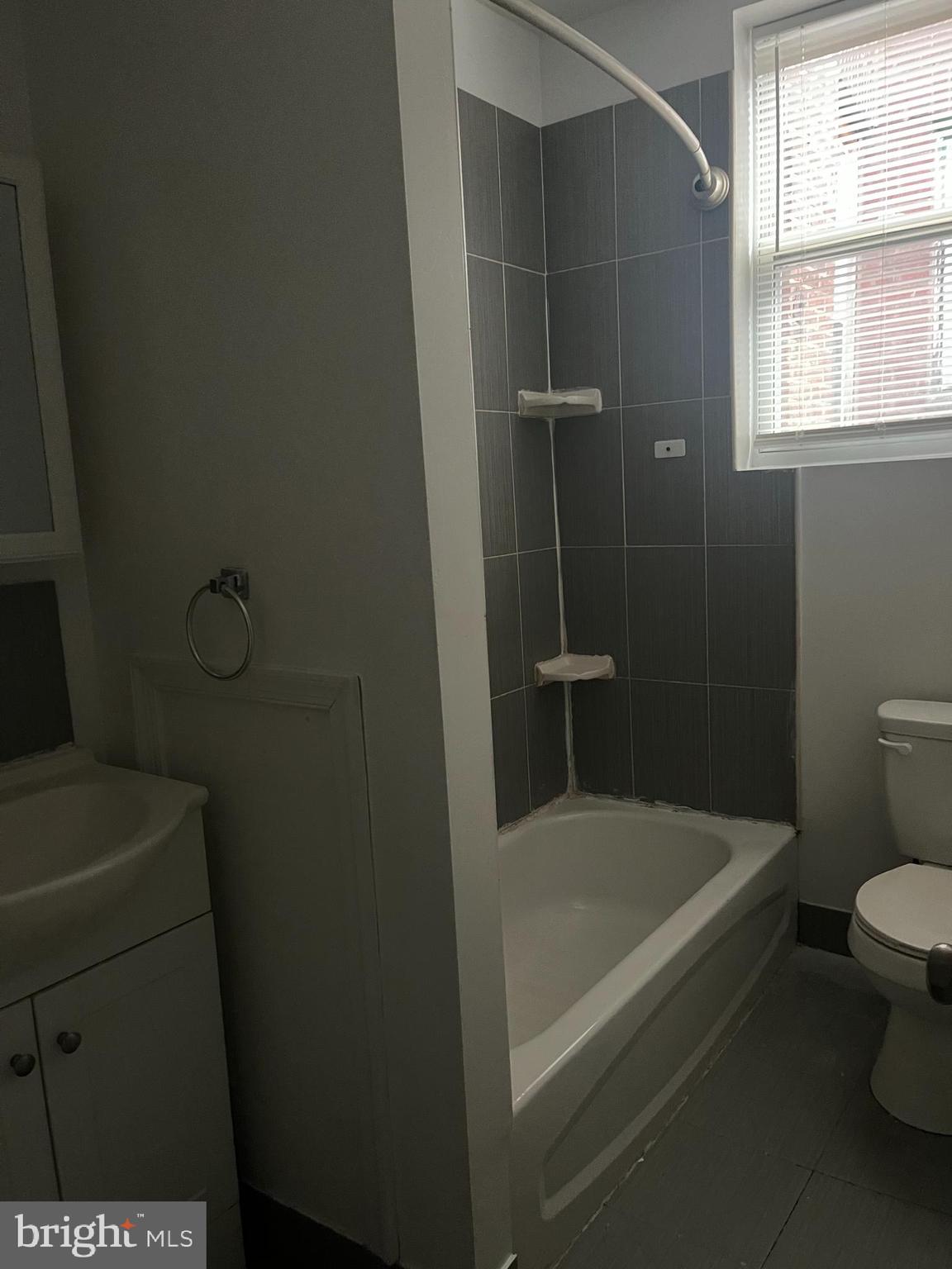 6122 North Broad Street Philadelphia, PA 19141 - Photo 4 of 18 a white bath tub sitting next to a toilet