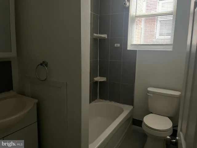 a bathroom with a toilet and a sink