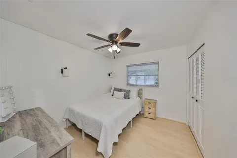 a bedroom with a bed and a table in it