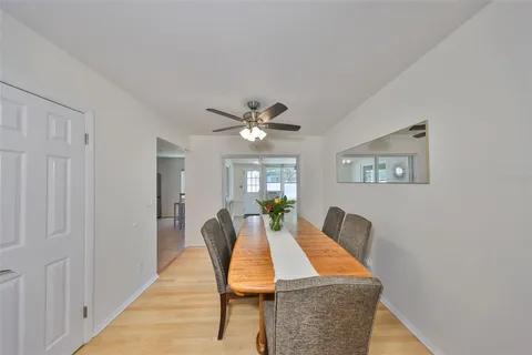 a dining room with furniture and window