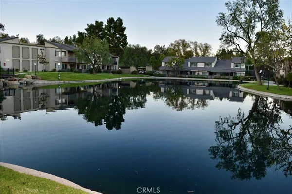 a view of multiple house with a yard