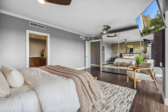 a bedroom with furniture and a wooden floor