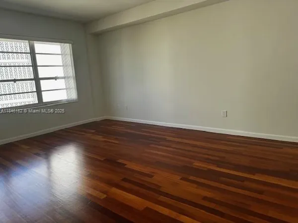 a view of a dining room with furniture and a potted plant
