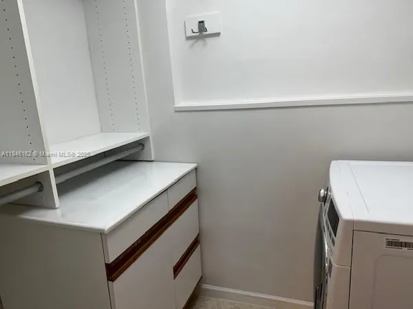 a table chair sitting in a room next to a window