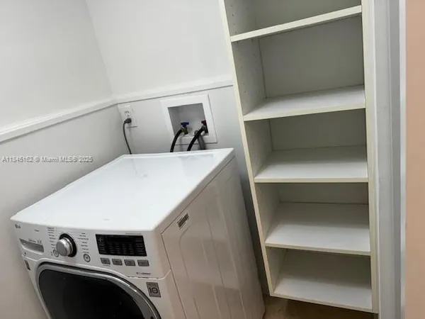 a view of a bike storage and utility room