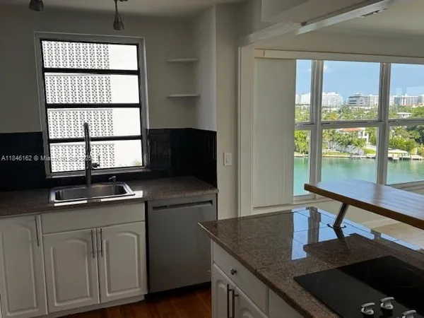 a couple of potted plants in front of door