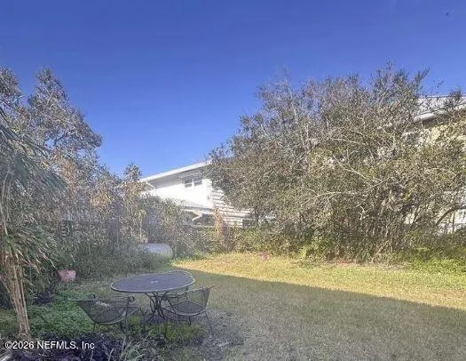 a view of a backyard of a house