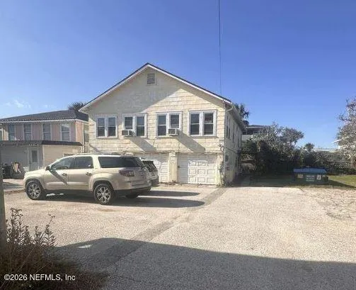 a view of a car parked in front of a house