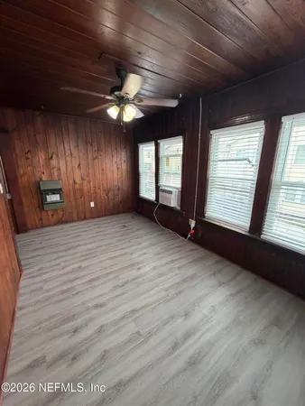 a view of an empty room with a window