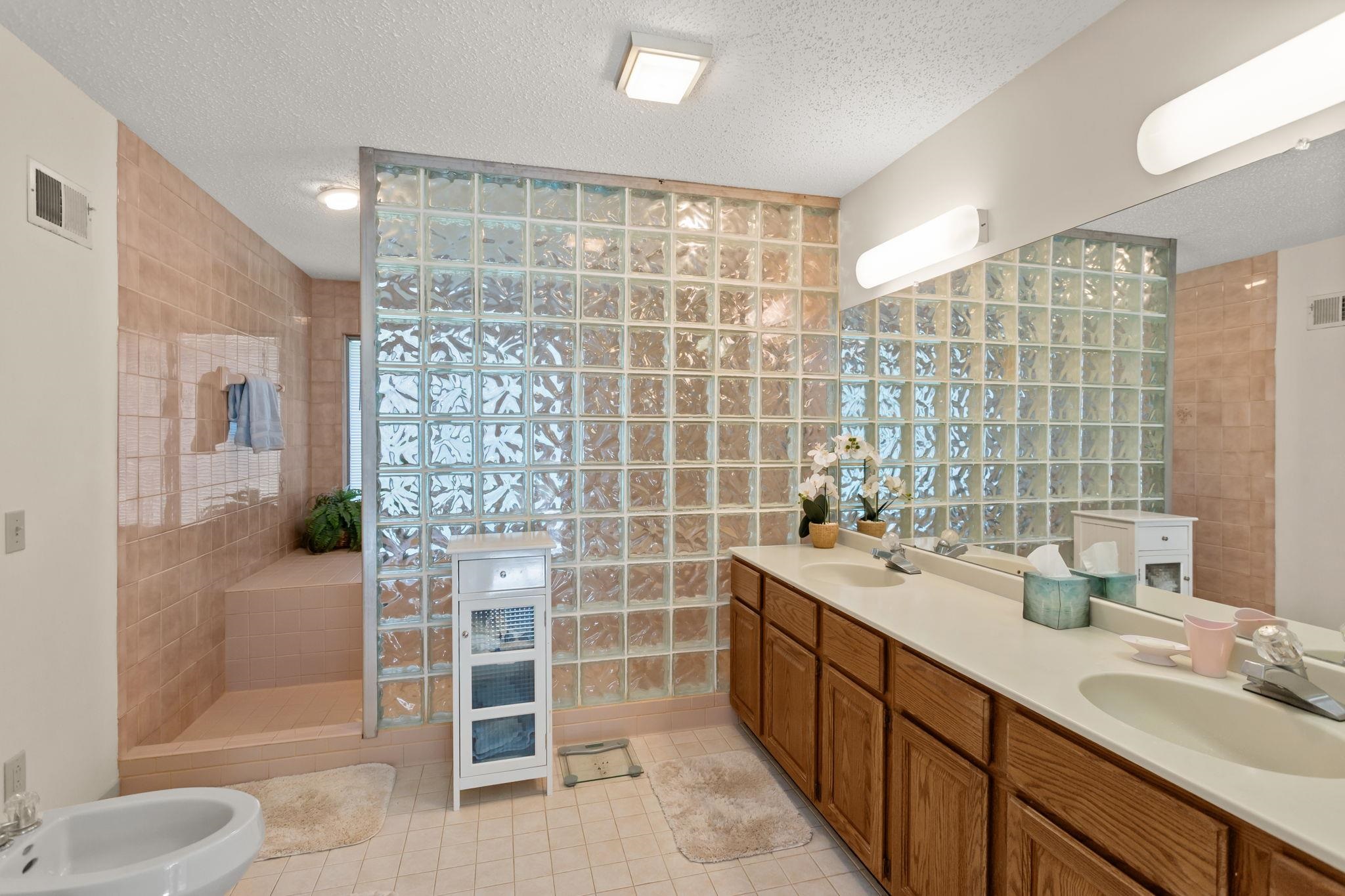 13004 Indian Trail Road Broadway, VA 22815 - Photo 26 of 56 a bathroom with a double vanity sink toilet and shower