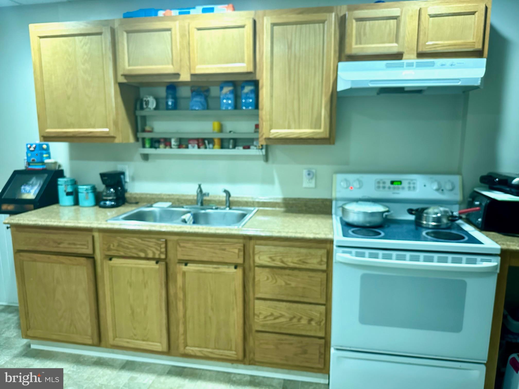 3411 Penn Avenue Sinking Spring, PA 19608 - Photo 7 of 13 a kitchen with a sink and cabinets