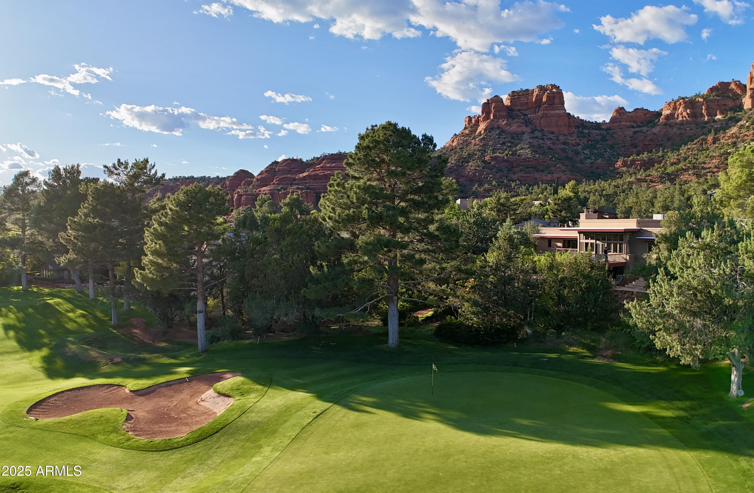 115 Merry Go Round Rock Road Sedona, AZ 86351 - Photo 3 of 33 115 MGRR Drone of golf course and house