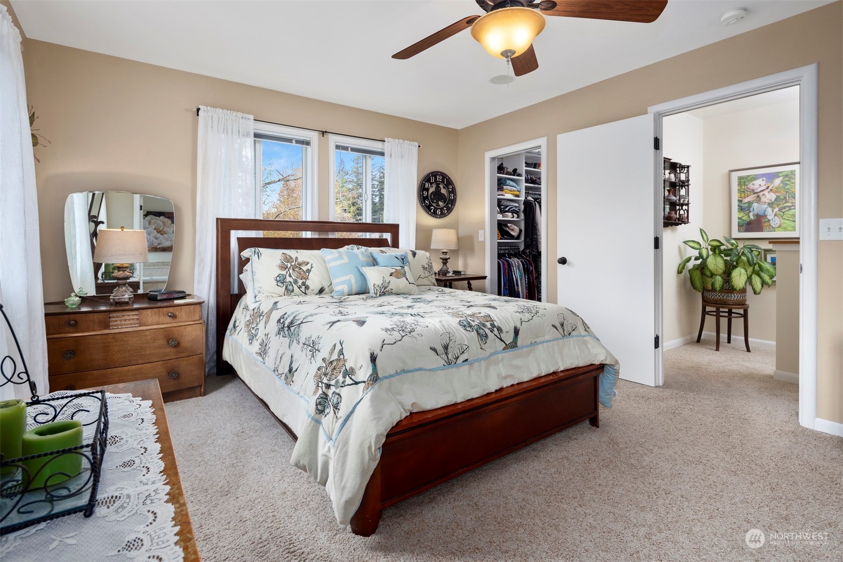 2931 McLeod Road Bellingham, WA 98225 - Photo 21 of 37 a bedroom with a bed and a chandelier