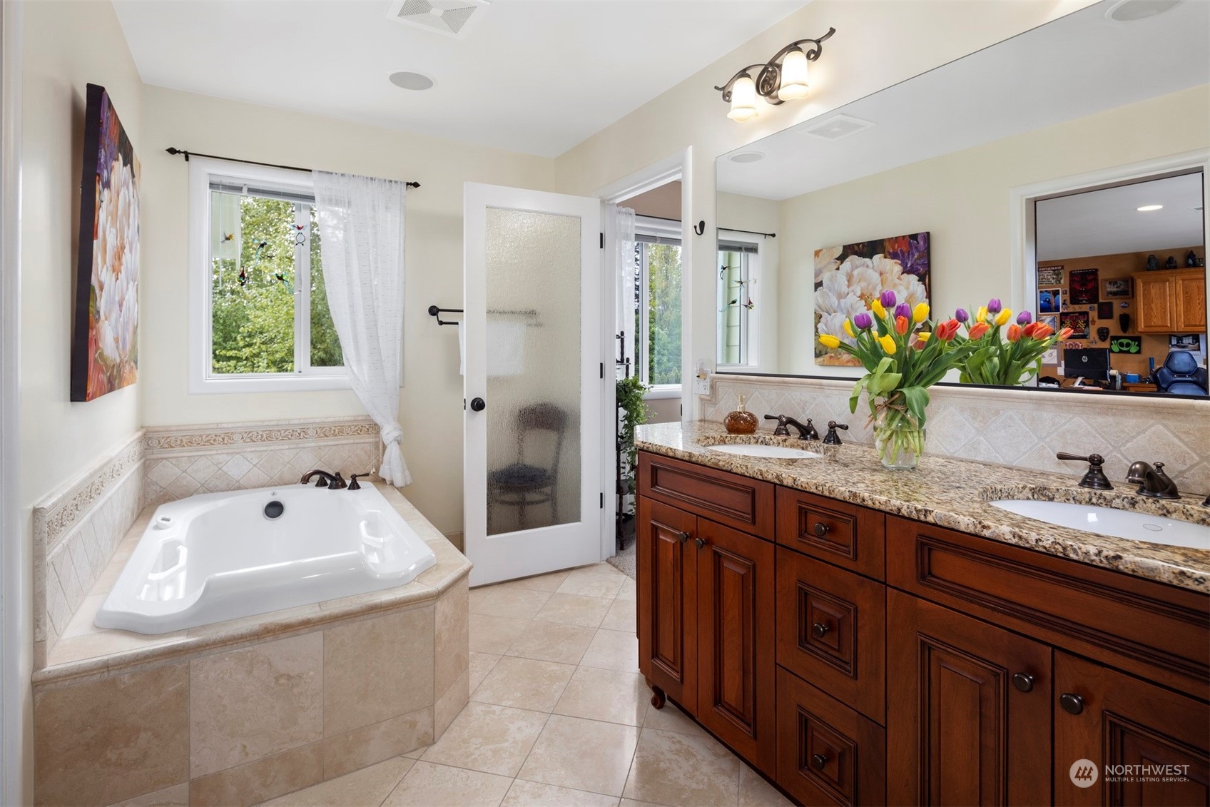 2931 McLeod Road Bellingham, WA 98225 - Photo 23 of 37 a spacious bathroom with a tub sink and mirror