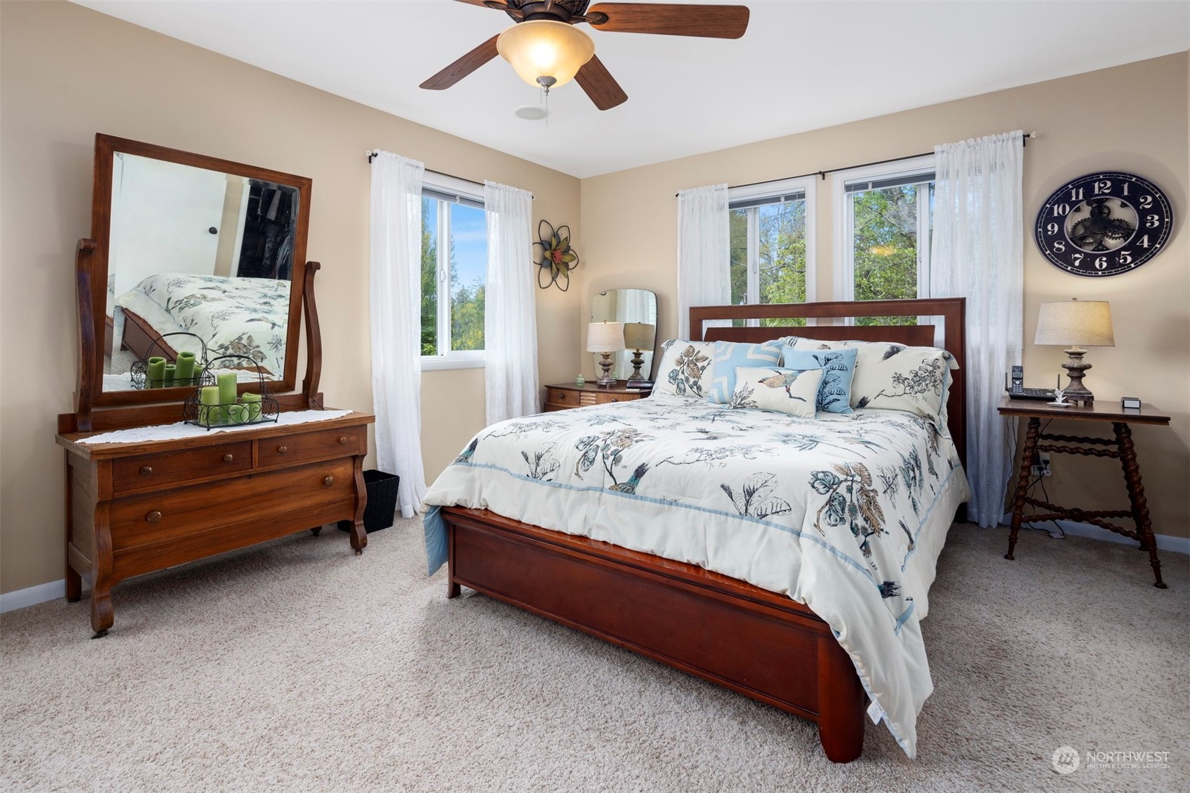 2931 McLeod Road Bellingham, WA 98225 - Photo 29 of 37 a bedroom with a bed and a chandelier