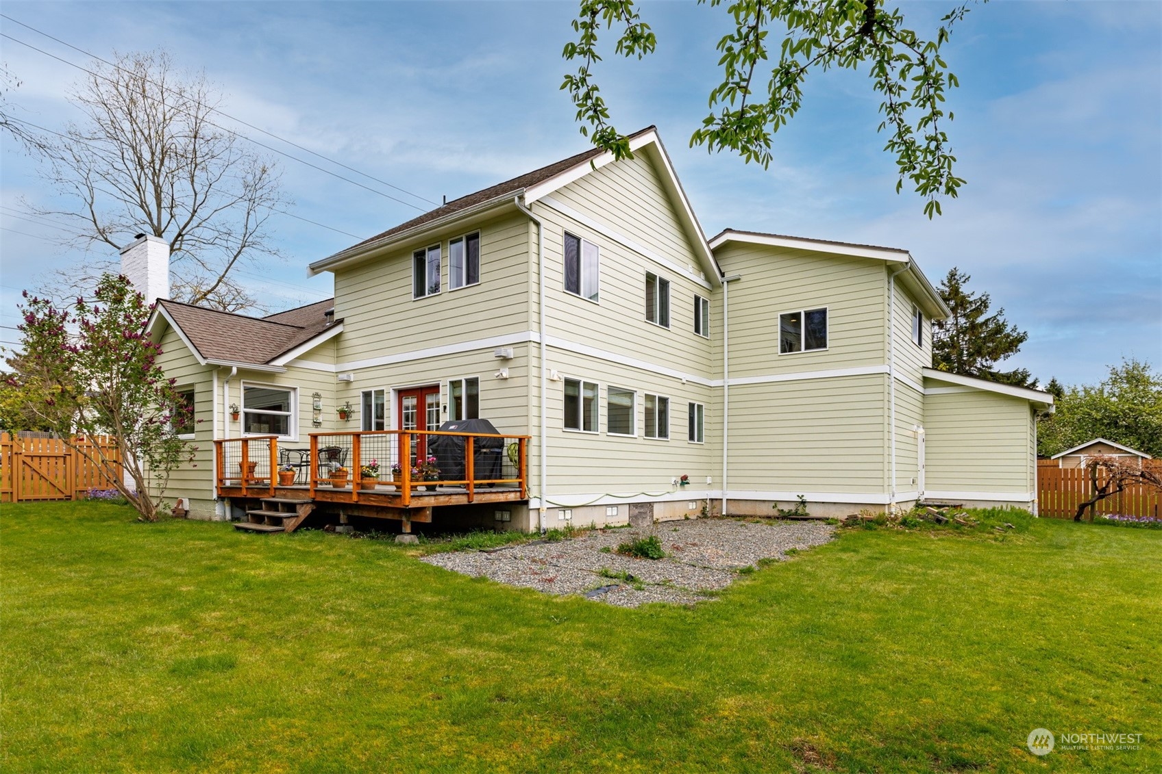 2931 McLeod Road Bellingham, WA 98225 - Photo 30 of 37 a view of a white house with a big yard and large trees