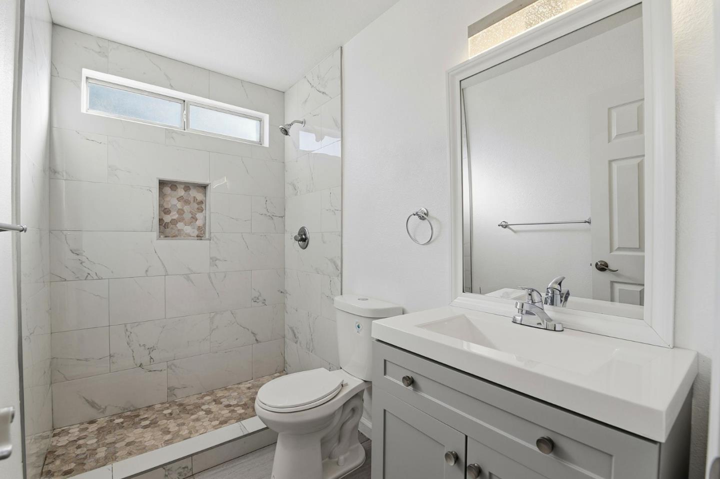 44648 17th Street East Lancaster, CA 93535 - Photo 16 of 21 a bathroom with a sink a toilet and shower