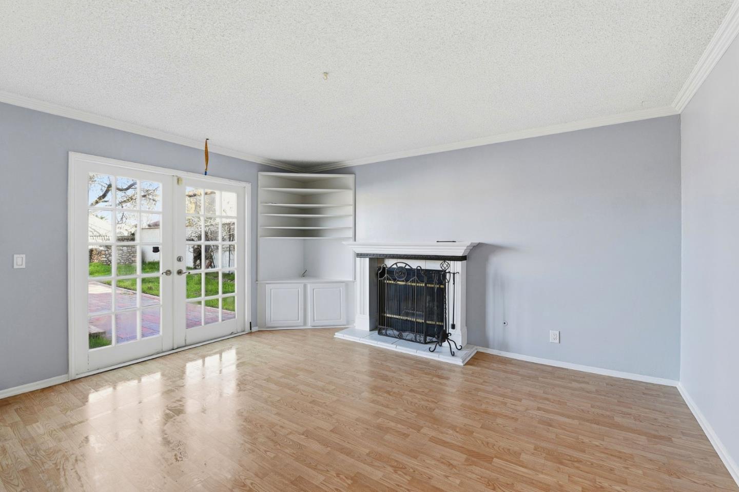 44648 17th Street East Lancaster, CA 93535 - Photo 8 of 21 a view of empty room with wooden floor and fireplace