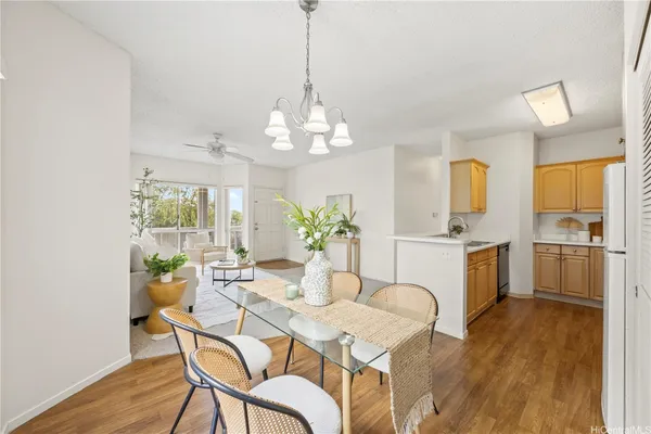 a dining room with furniture a livingroom and chandelier