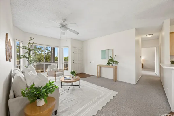a living room with furniture and a large window
