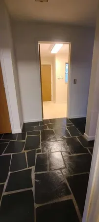 a room with pool table and mirror