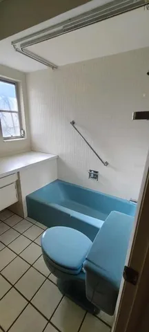 a view of a livingroom with gym equipment