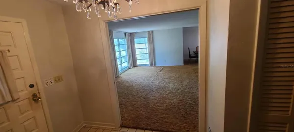 a view of a livingroom with stairs