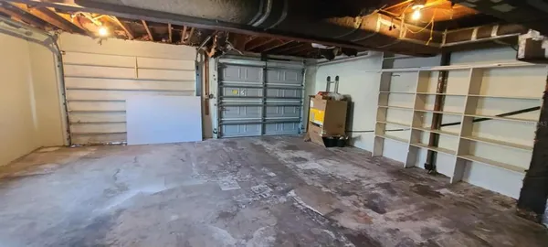 a kitchen with stainless steel appliances granite countertop a sink and a refrigerator