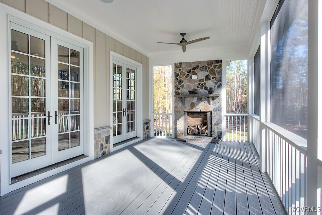 3530 Old Gun Road West Midlothian, VA 23113 - Photo 21 of 37 a view of a livingroom with wooden floor a fireplace and windows