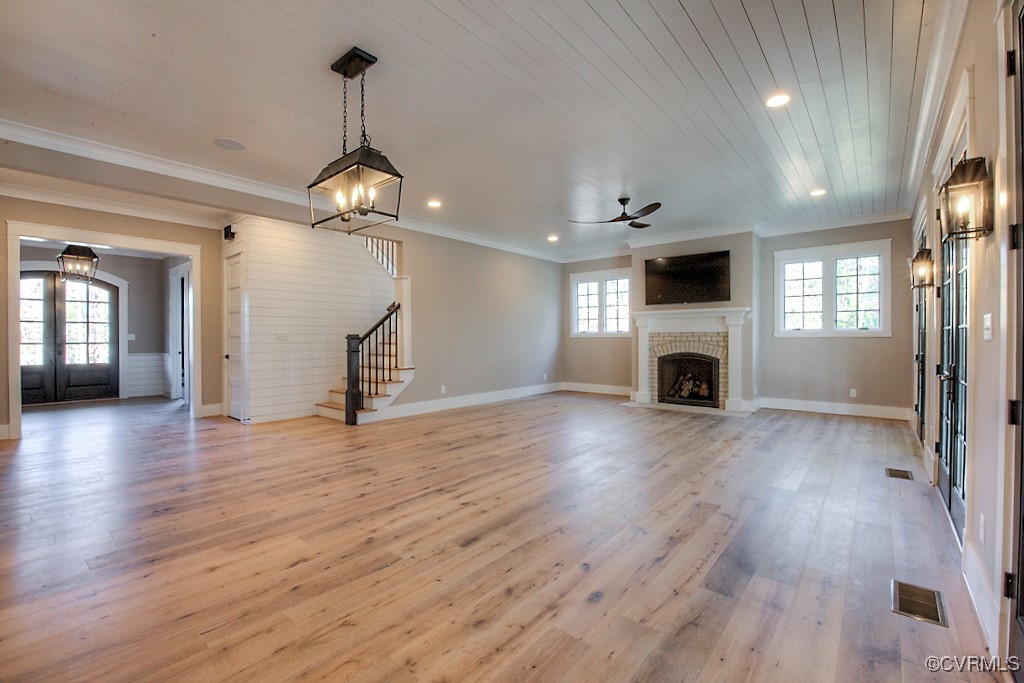 3530 Old Gun Road West Midlothian, VA 23113 - Photo 6 of 37 a view of a livingroom with furniture a fireplace wooden floor and chandelier