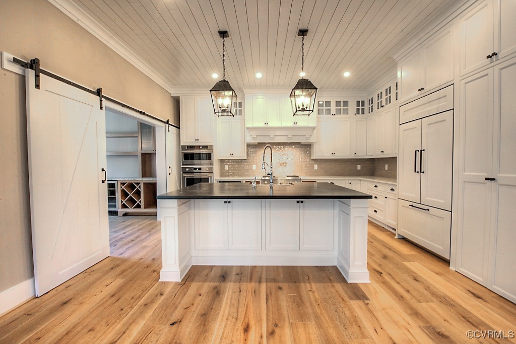 3530 Old Gun Road West Midlothian, VA 23113 - Photo 10 of 37 a kitchen with stainless steel appliances granite countertop a refrigerator a sink dishwasher a oven and white cabinets with wooden floor