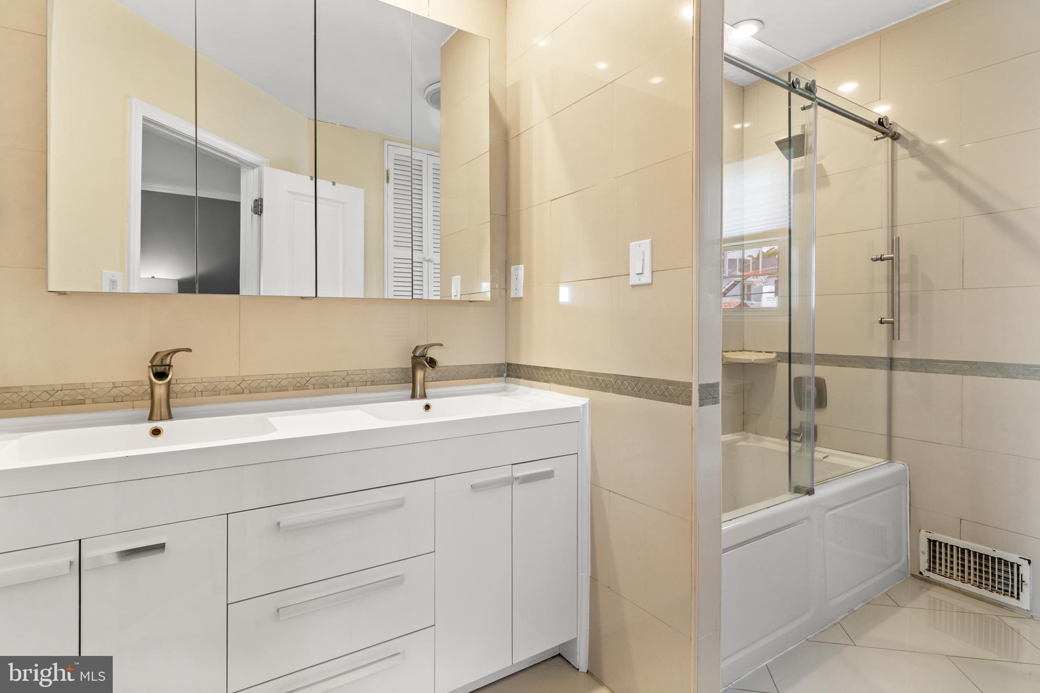 3302 Northbrook Road Baltimore, MD 21208 - Photo 16 of 35 a bathroom with a bathtub and a sink