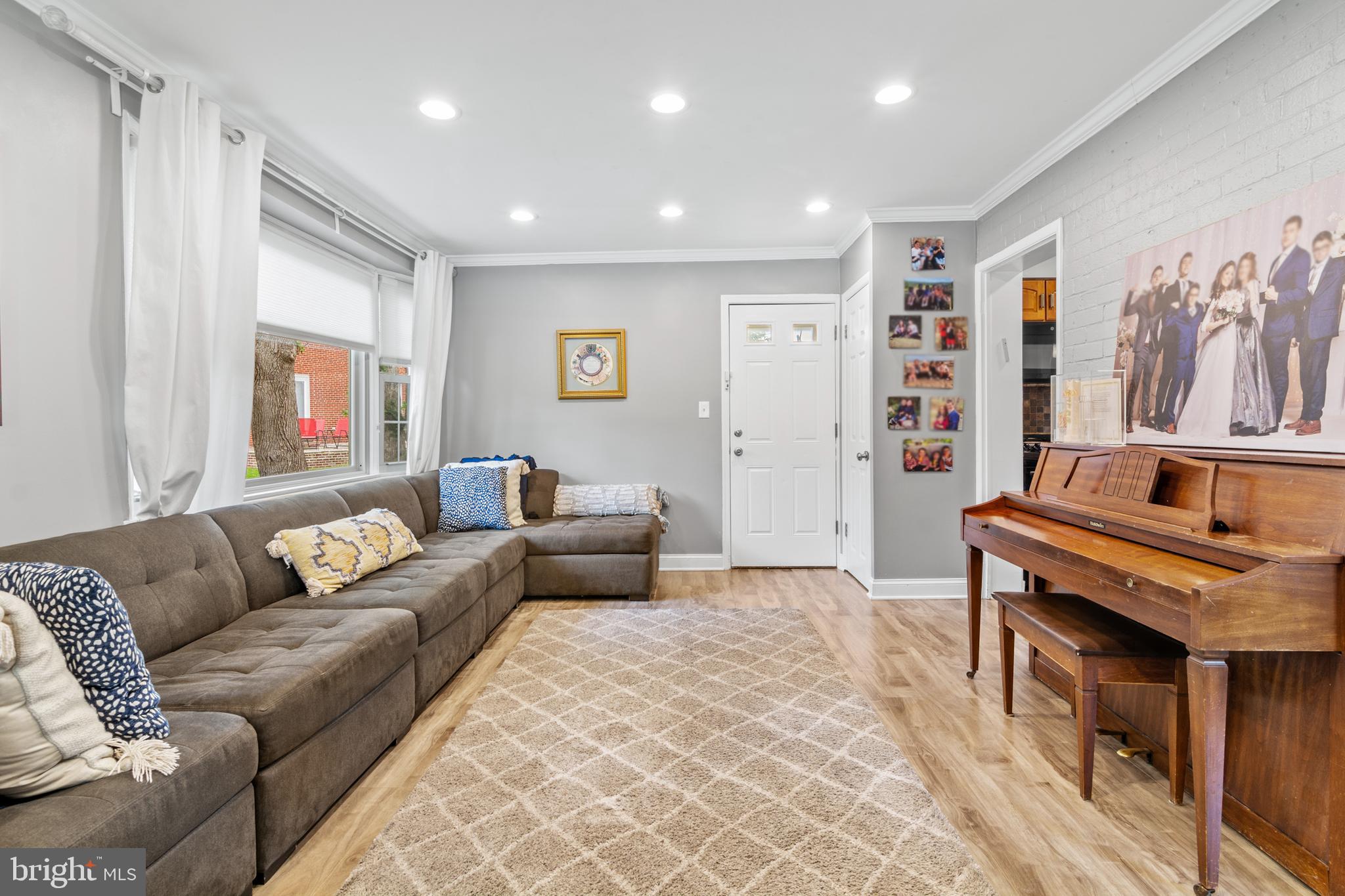 3302 Northbrook Road Baltimore, MD 21208 - Photo 2 of 35 a living room with furniture and a piano