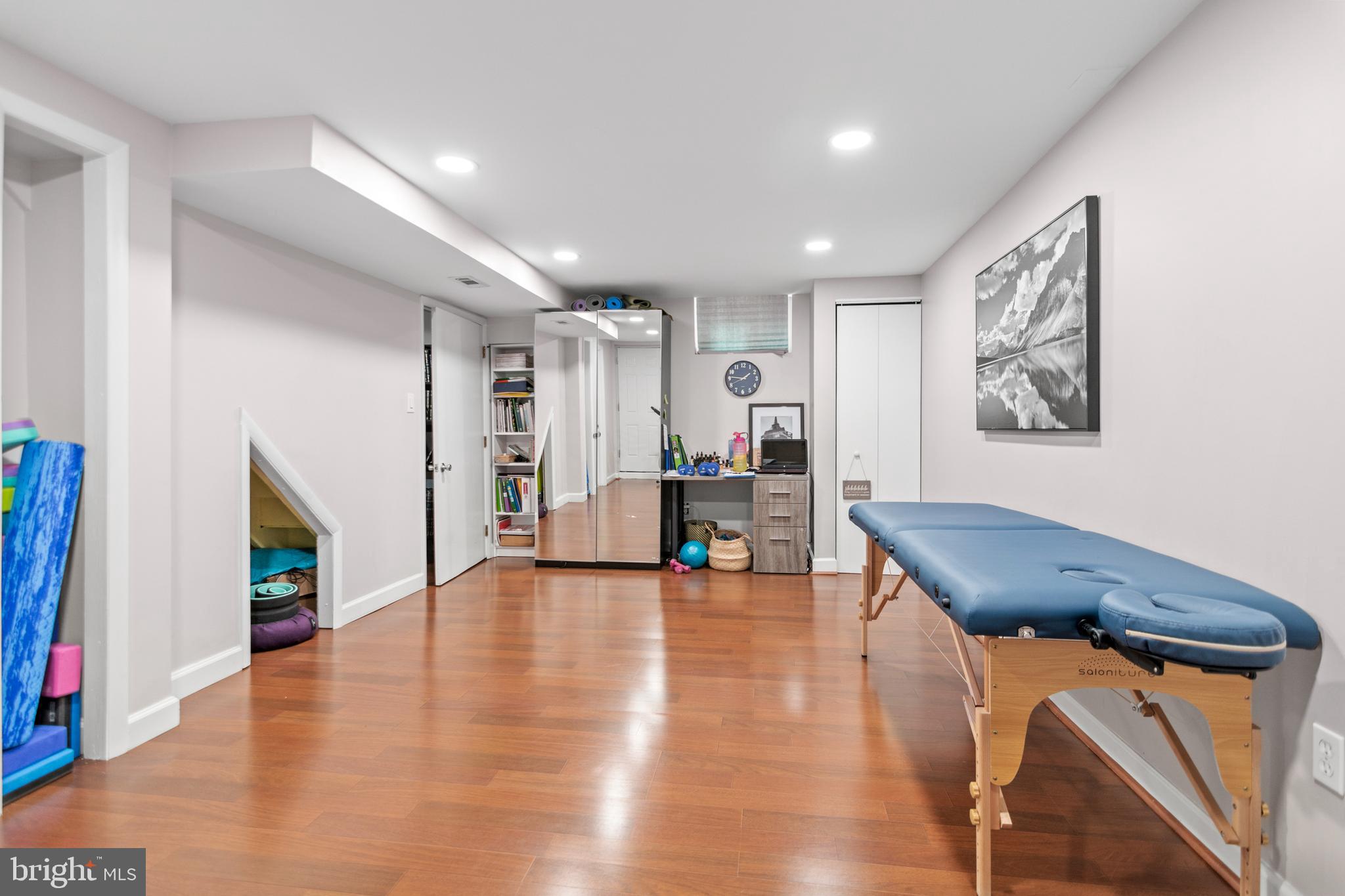 3302 Northbrook Road Baltimore, MD 21208 - Photo 22 of 35 a view of a room with wooden floor and stairs