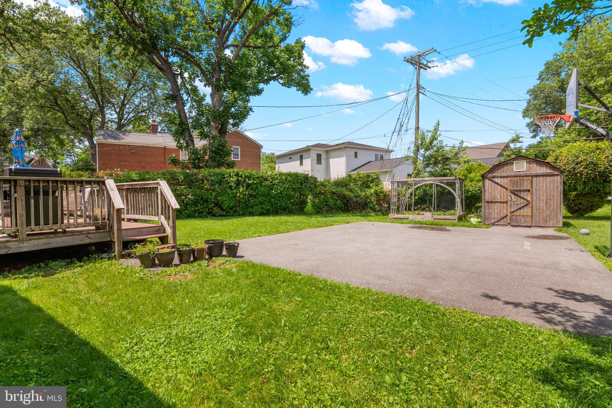 3302 Northbrook Road Baltimore, MD 21208 - Photo 30 of 35 a view of a chair and table in backyard of the house