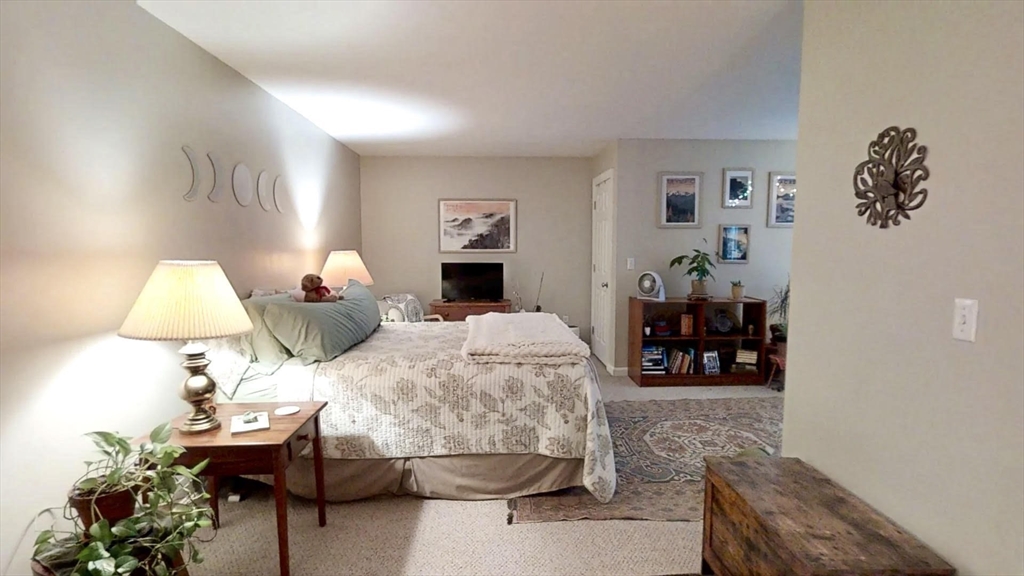 216 Main Street, Unit A2 Maynard, MA 01754 - Photo 12 of 18 a living room with furniture and a lamp