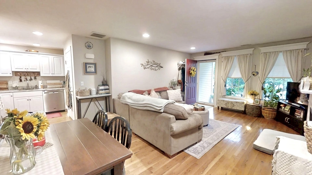 216 Main Street, Unit A2 Maynard, MA 01754 - Photo 5 of 18 a living room with furniture and a large window