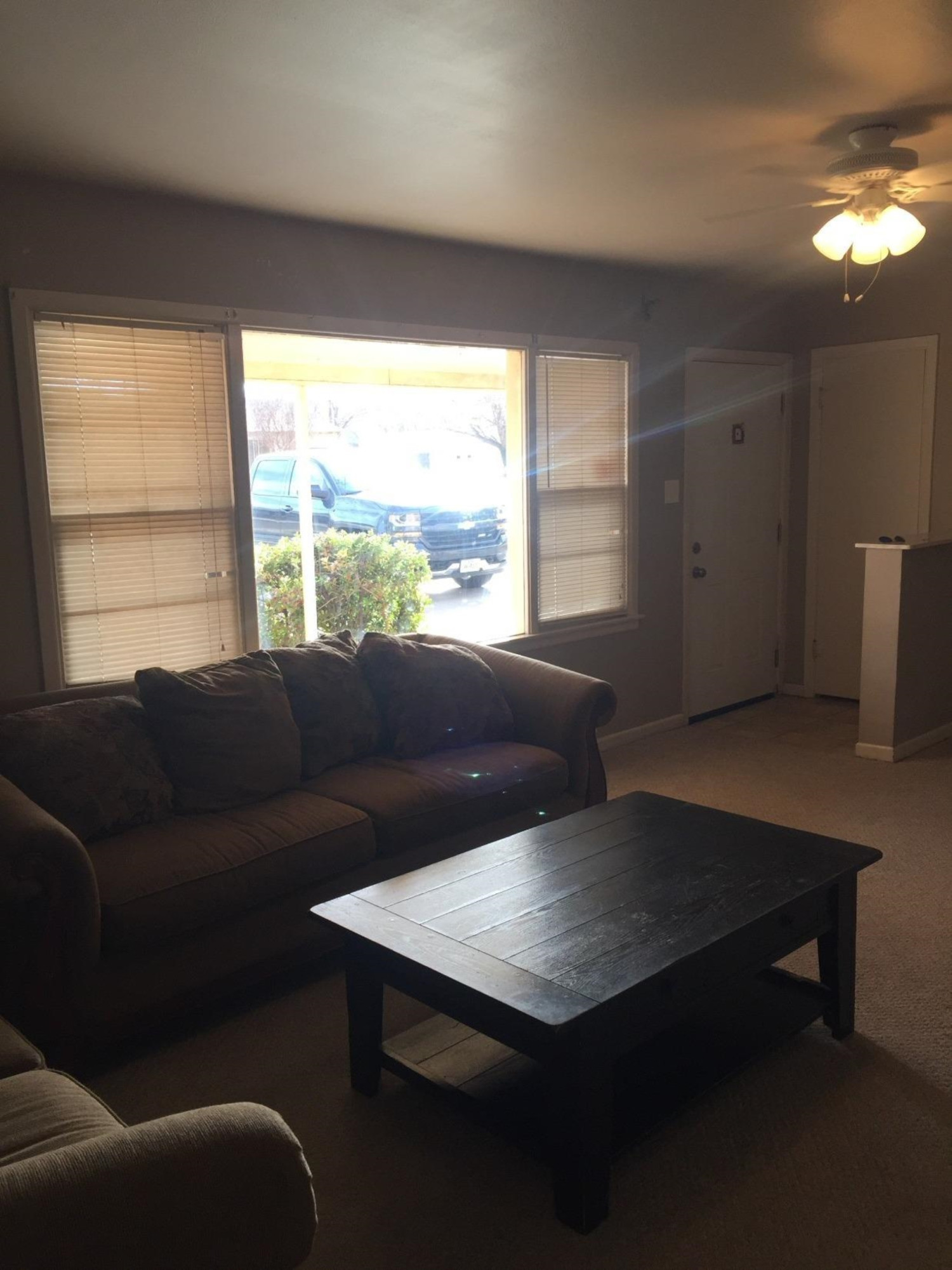 3216 36th Street Lubbock, TX 79413 - Photo 2 of 11 a living room with furniture and a large window